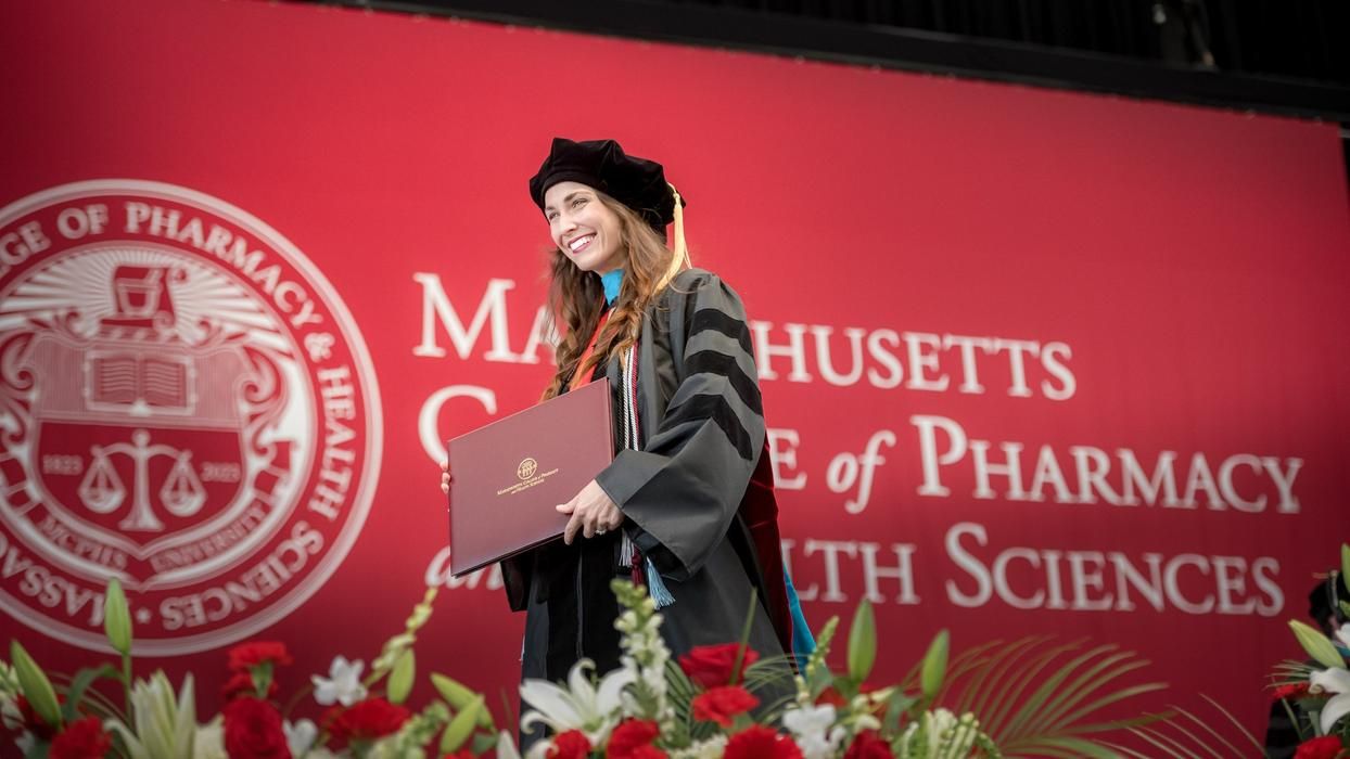 Katherine Kulyk crosses the stage at MCPHS Commencement