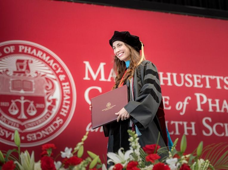 Katherine Kulyk crosses the stage at MCPHS Commencement