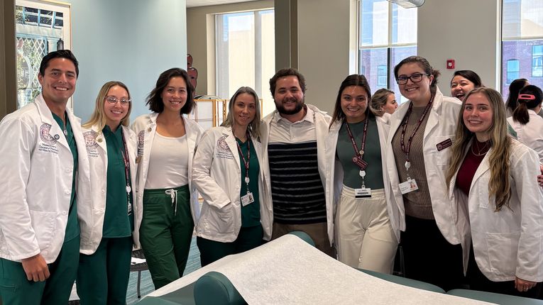 MCPHS students wearing lab coats.