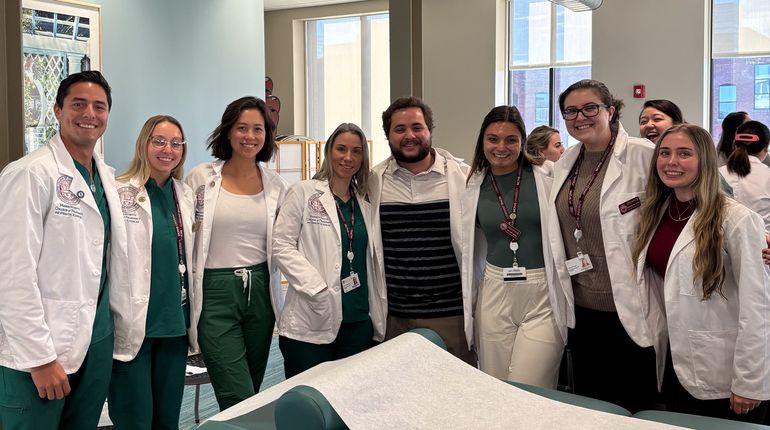 MCPHS students wearing lab coats.