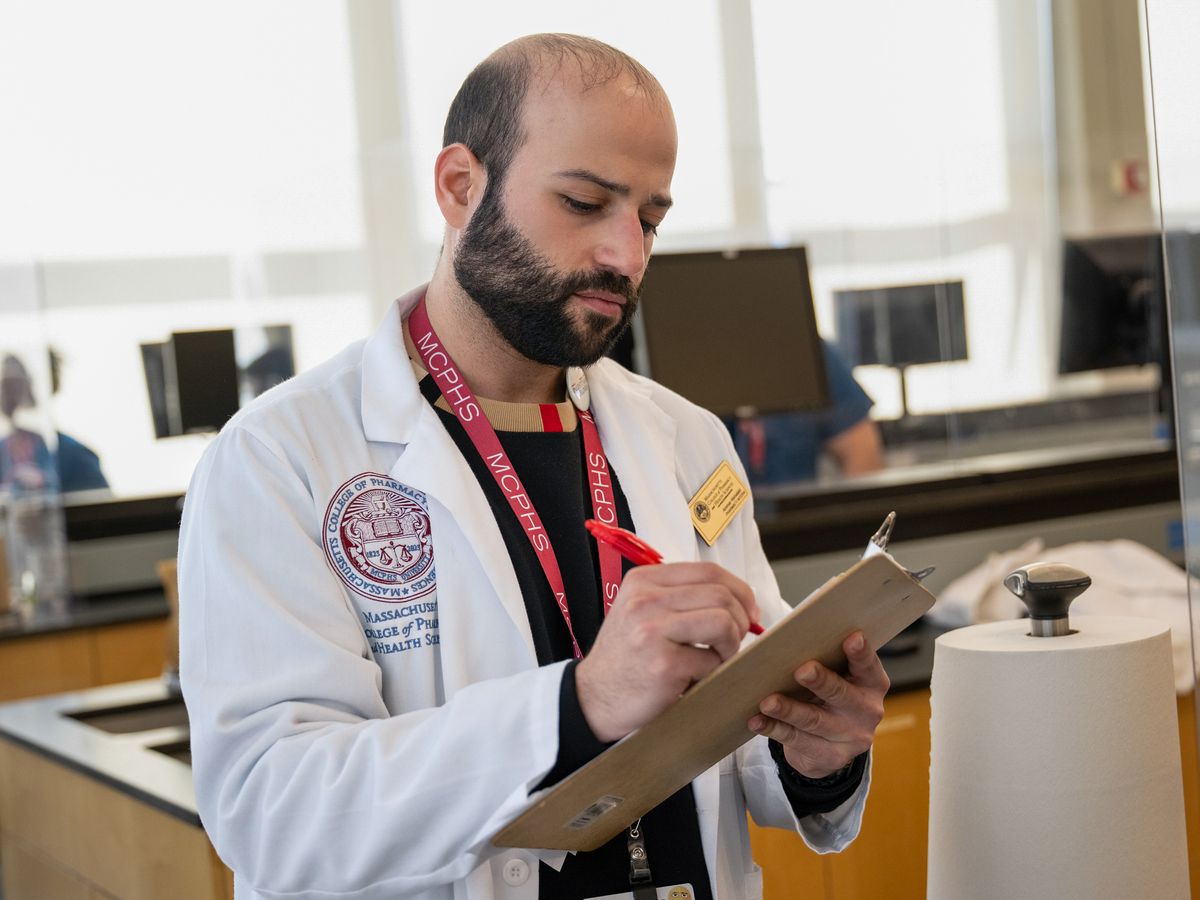 Pharmacy students working in lab and class on the Worcester campus