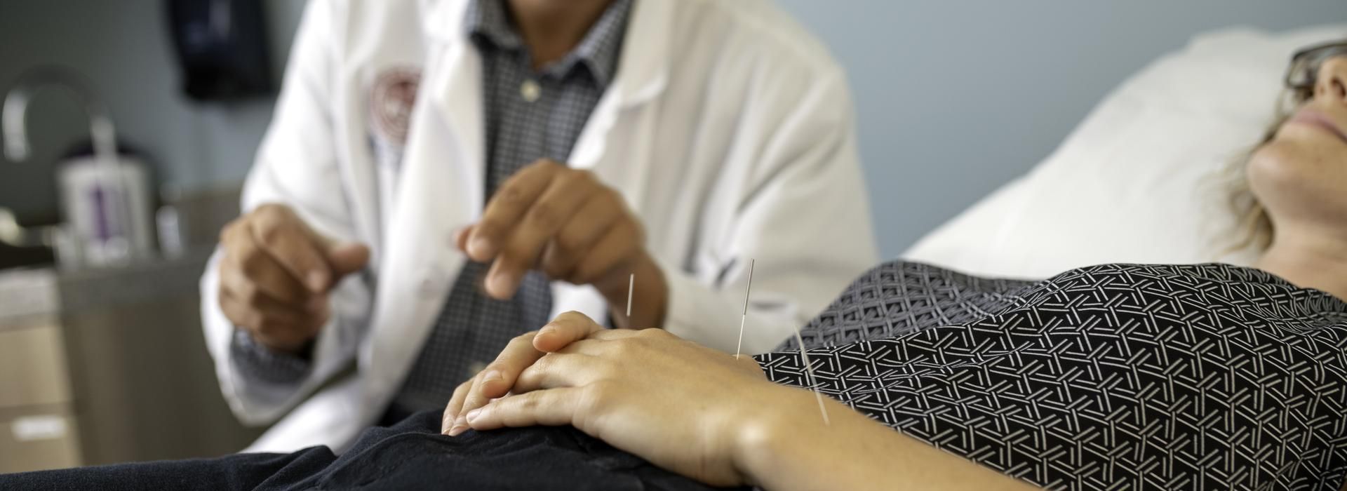 Close up of Acupuncture needles in female patient. 