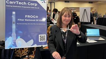 Sue Carr holds an all-in-one filter and needle that she developed.
