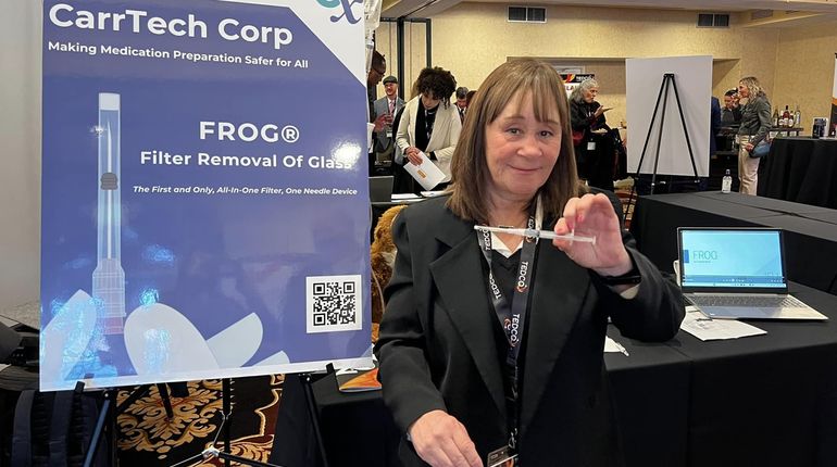 Sue Carr holds an all-in-one filter and needle that she developed.