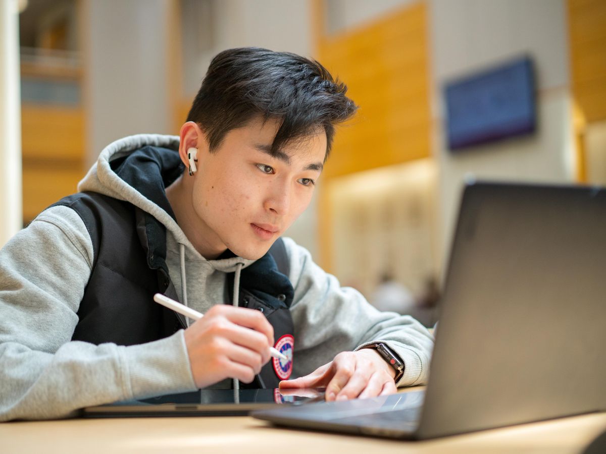 Male student on laptop