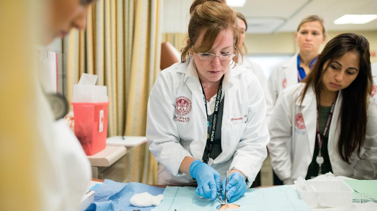 Physician Assistant Studies faculty and students in the PA Simulation lab.