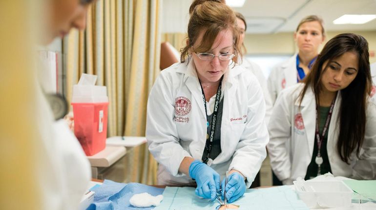 Physician Assistant Studies faculty and students in the PA Simulation lab.