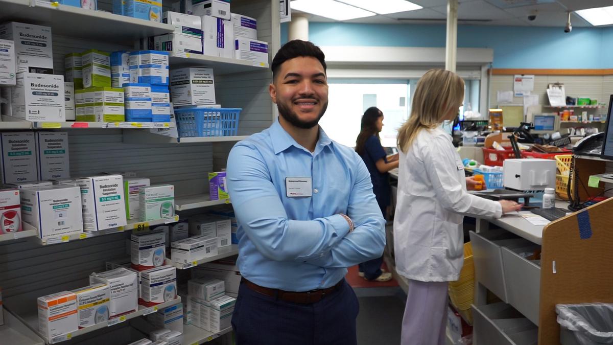 Muhammad Elsweesy standing in a pharmacy.