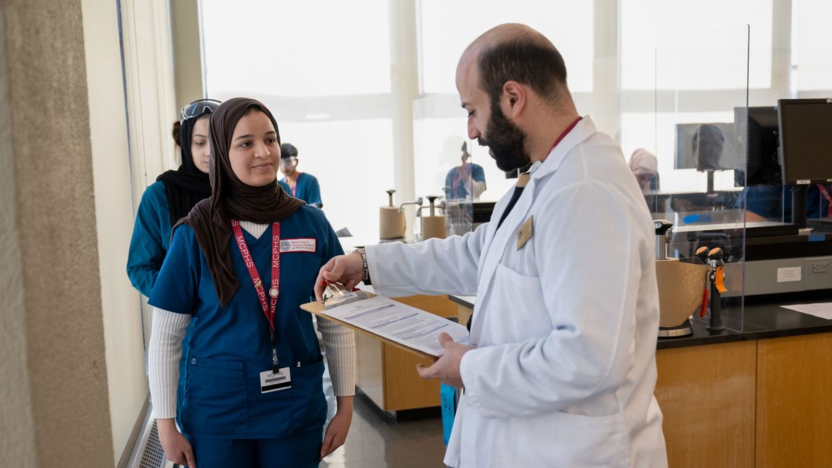 Pharmacy students working in lab and class on the Worcester campus