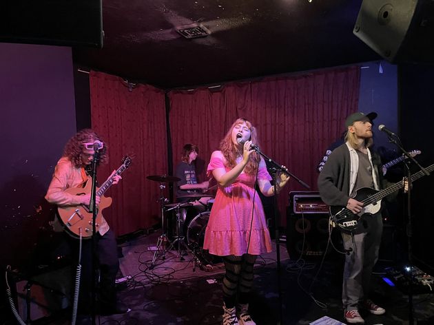 Kathryn Day sings on stage with her band.