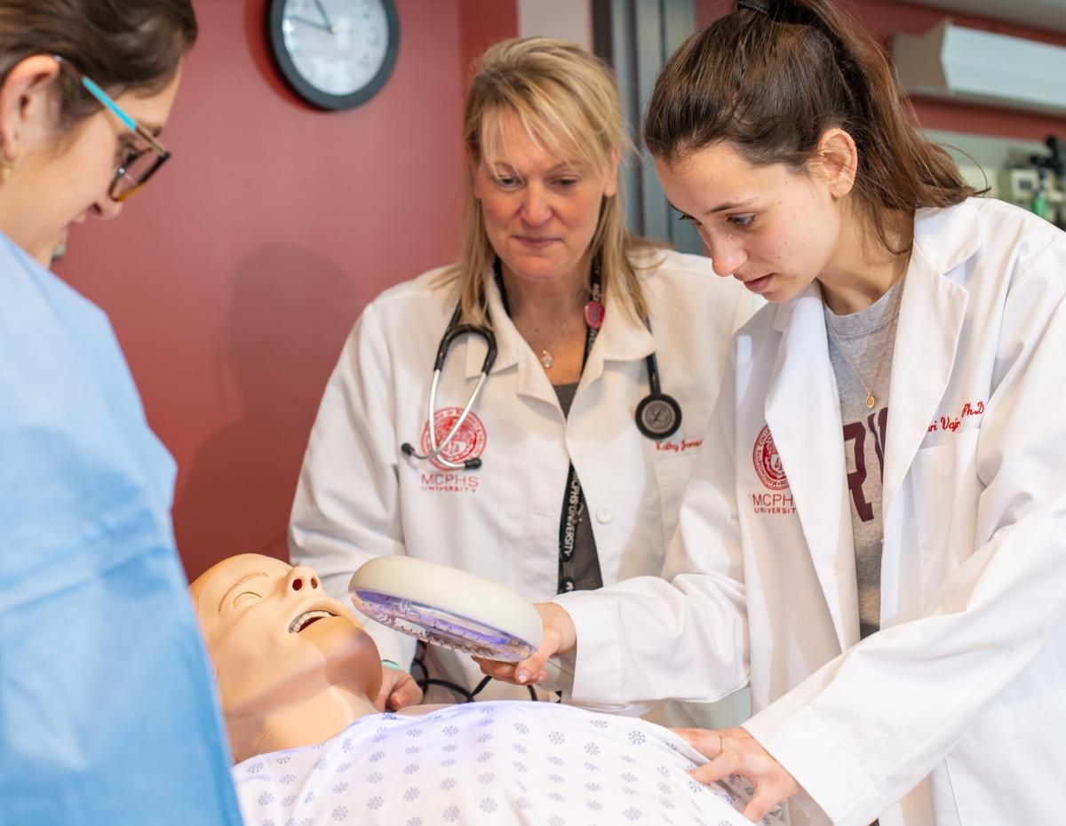 PA student and Professor working on a mannequin