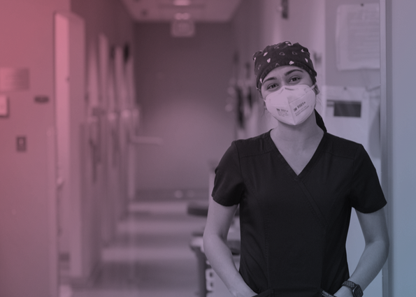 Female in scrubs and a mask. 