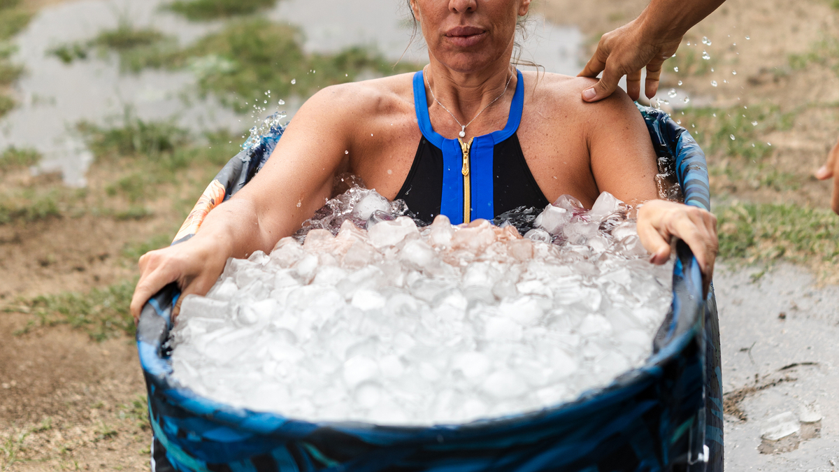 Woman Sits in Ice Bath