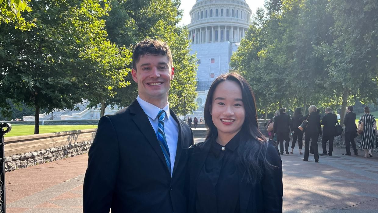 Dempsey Goodale, MPAS '25, and Minh Tran, MPAS '25, BS '23 pose in front of the U.S. Capitol Building