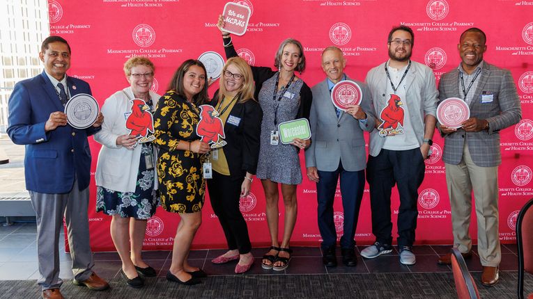 Faculty, staff, and alumni celebrating the 25th anniversary of MCPHS Worcester.