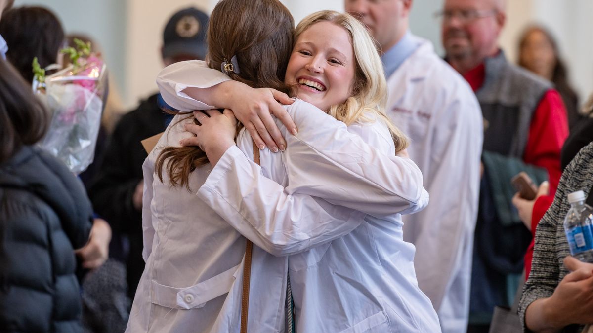 Students in cap and gowns at Commencement. 