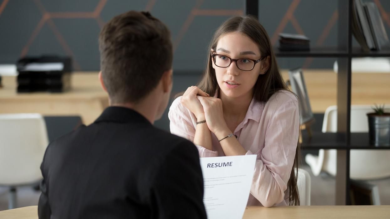 Female interviewing with resume. .