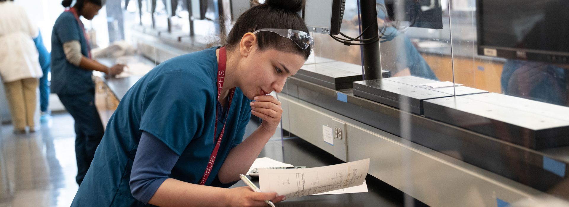 Pharmacy students working in lab and class on the Worcester campus