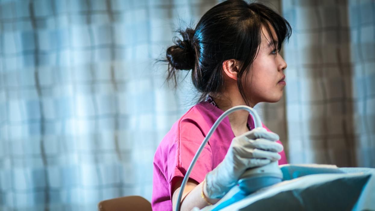 Student in MCPHS Diagnostic Medical Sonography lab.