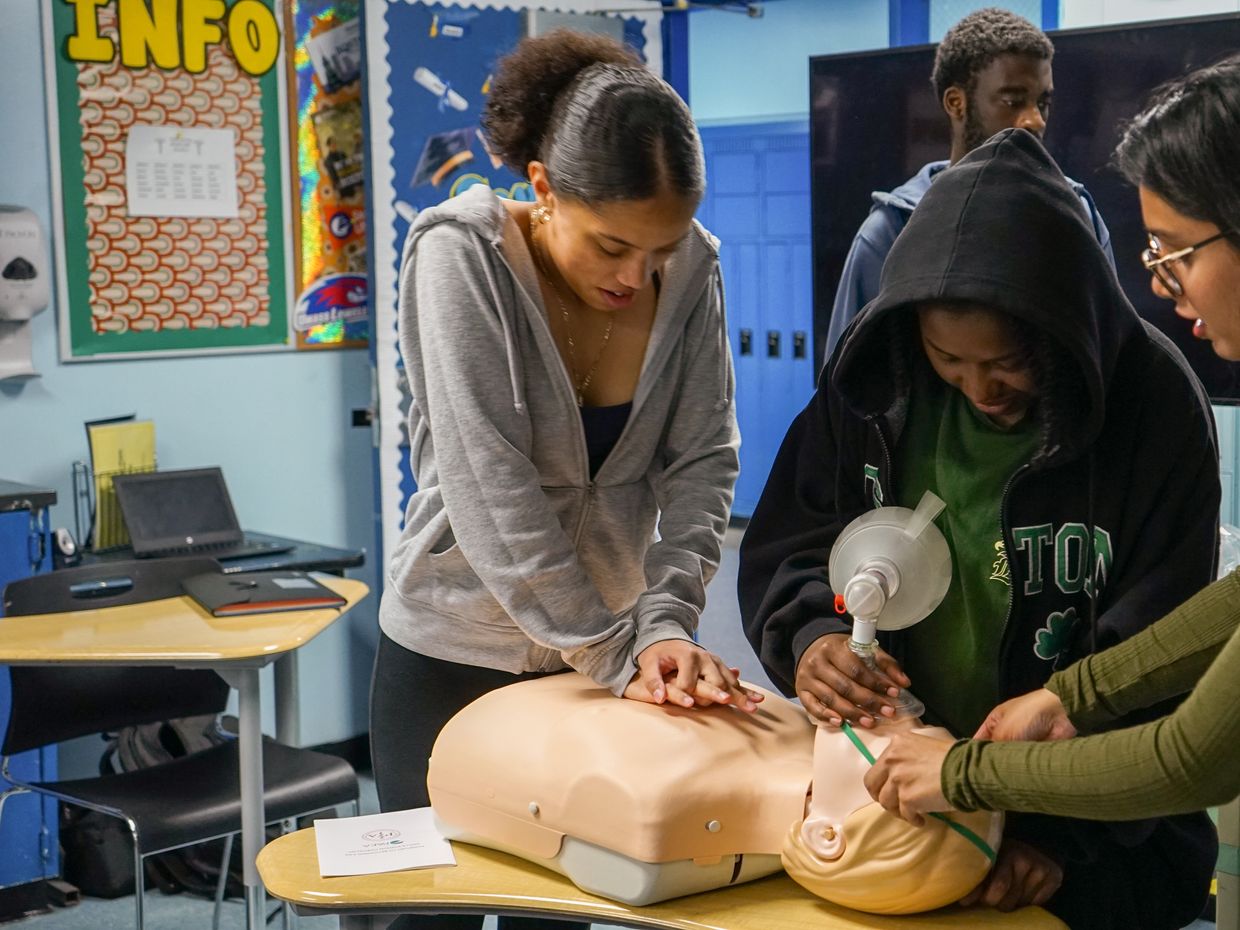 Students practice CPR skills.