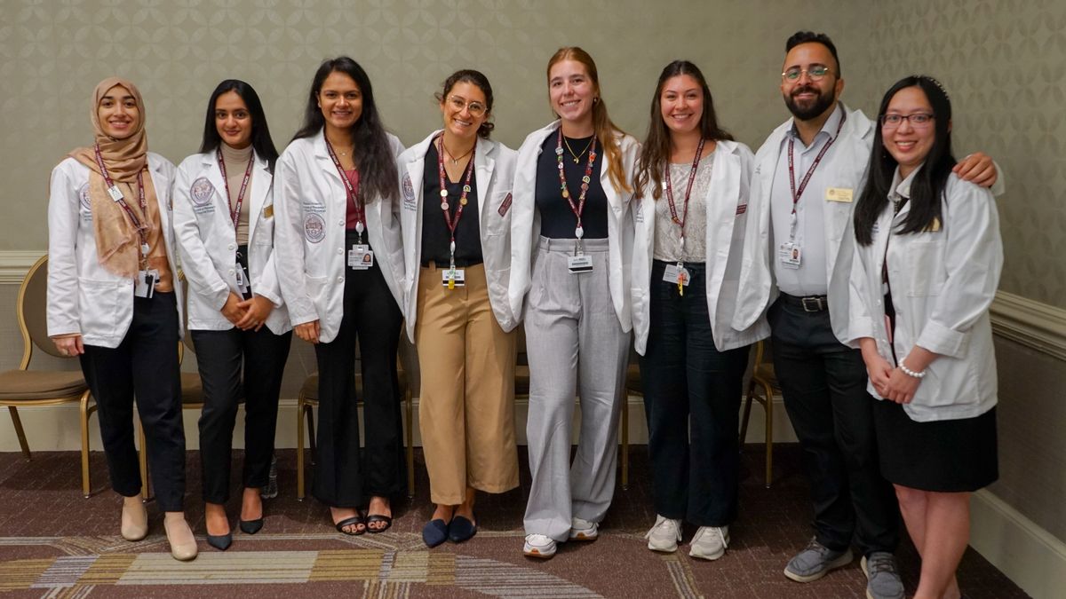 MCPHS Students wearing lab coats.
