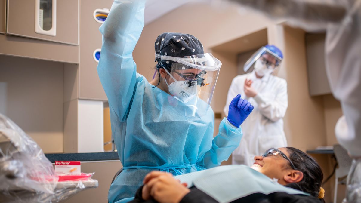  Dental hygiene student with patient. 