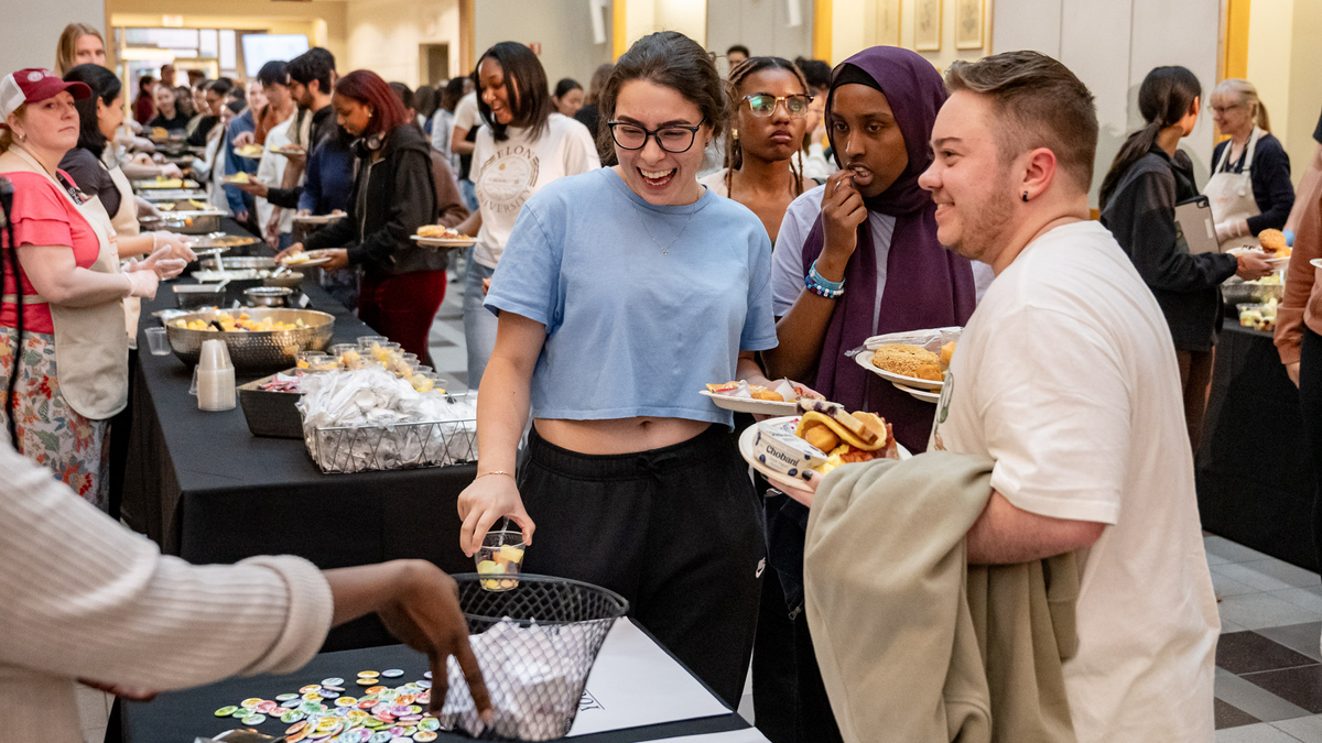 Students eat breakfast at the MCPHS Late Night Breakfast..