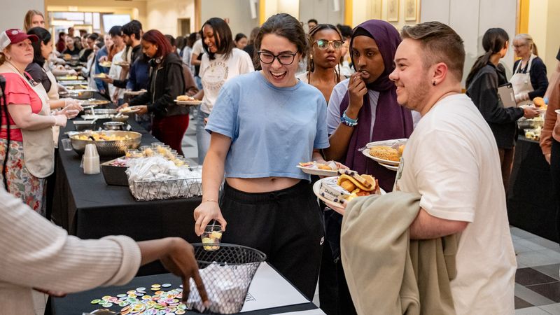 Students eat breakfast at the MCPHS Late Night Breakfast..