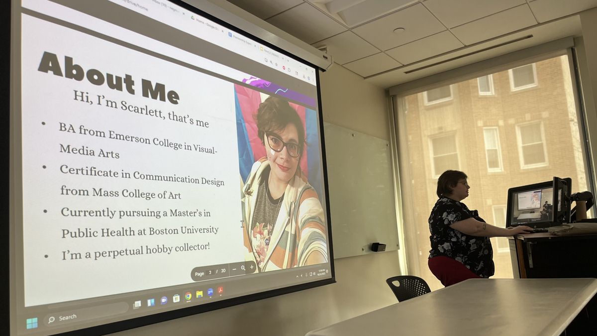 Scarlett Shiloh stands at a podium in front of a screen.