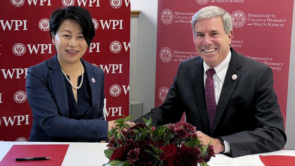 WPI President Grace Wang and MCPHS President Richard J. Lessard sign a formal agreement between the two institutions that will expand pathways.   