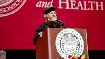  Timothy “TJ” Parker speaking at MCPHS Commencment 2026.