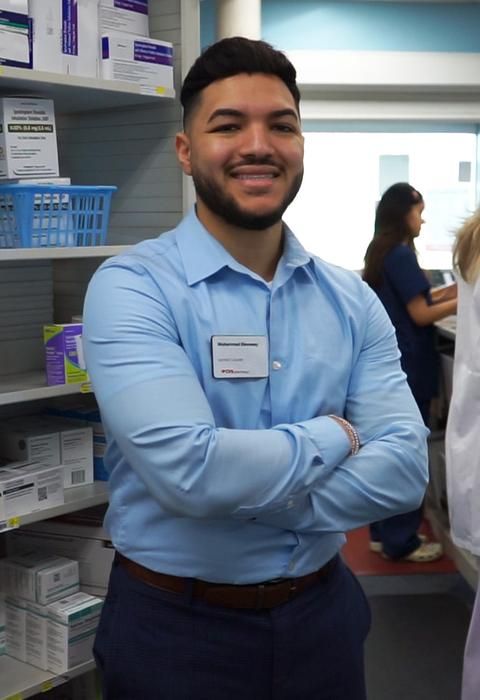 Muhammad Elsweesy standing in a pharmacy.