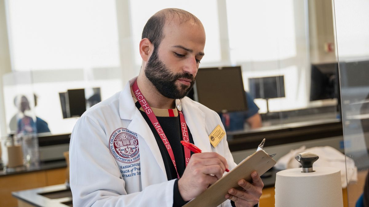 Pharmacy students working in lab and class on the Worcester campus
