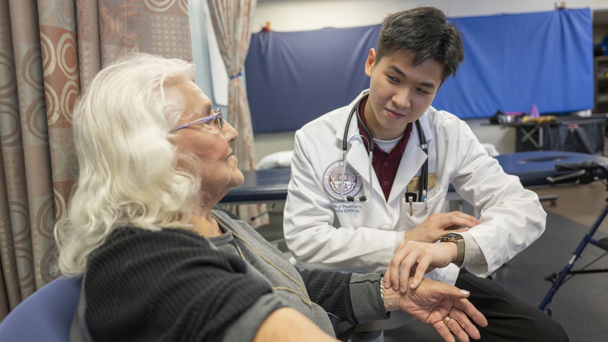 Physical Therapy students working with patients in lab setting