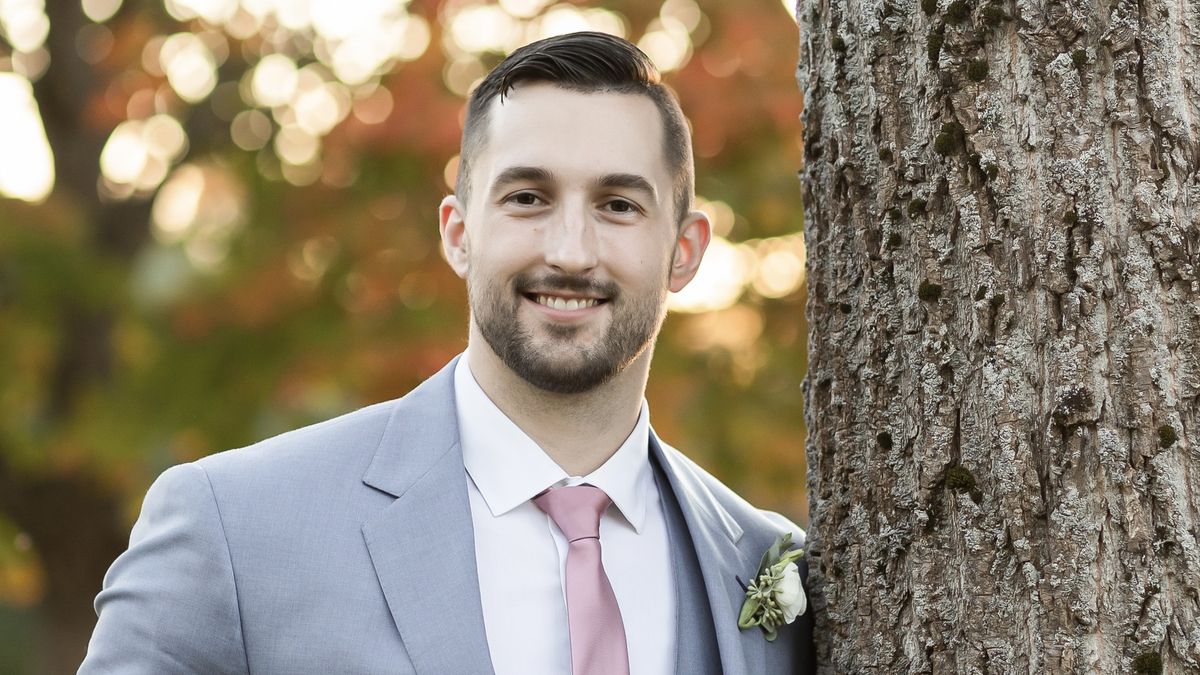 Michael Soden standing next to a tree.