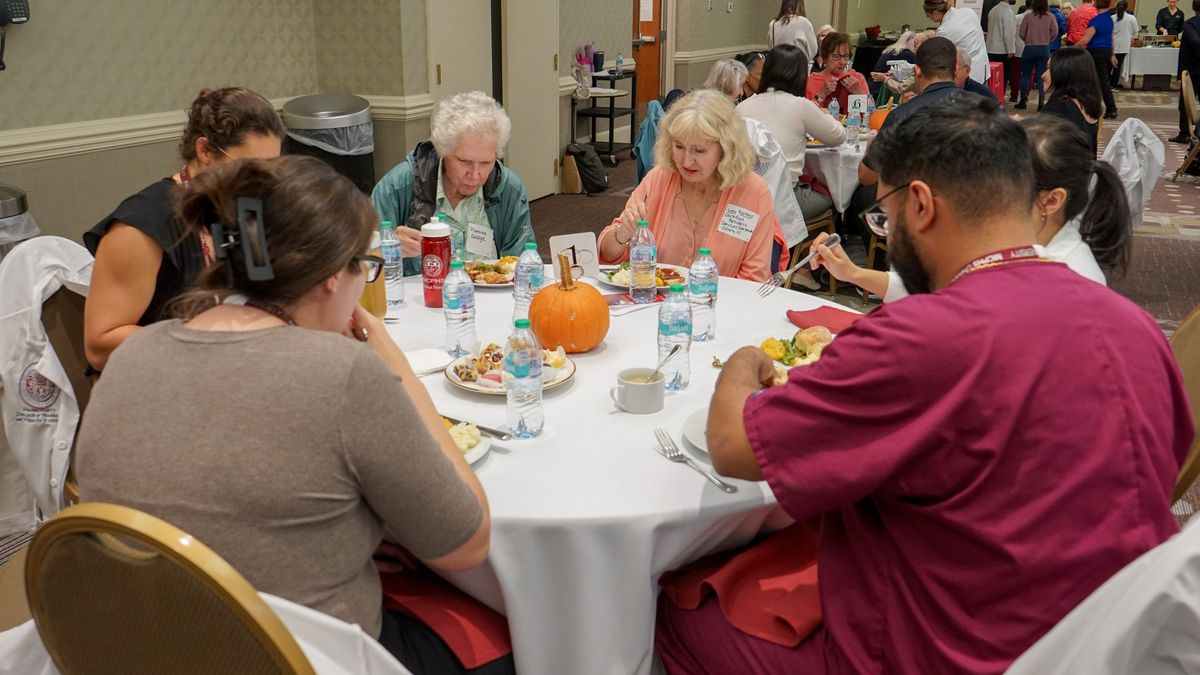 MCPHS students and community members share a meal at the IPE Fall Awareness event.