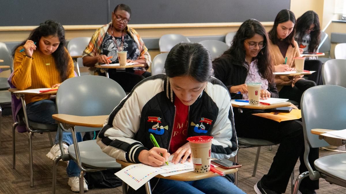 MCPHS students and faculty writing letters to older adults to combat loneliness.