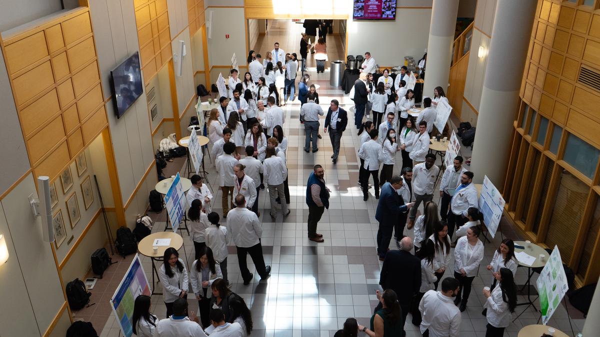 Students, faculty and judges survey the projects during the the School of Pharmacy's 20th annual Capstone Business Plan Competition on April 10.