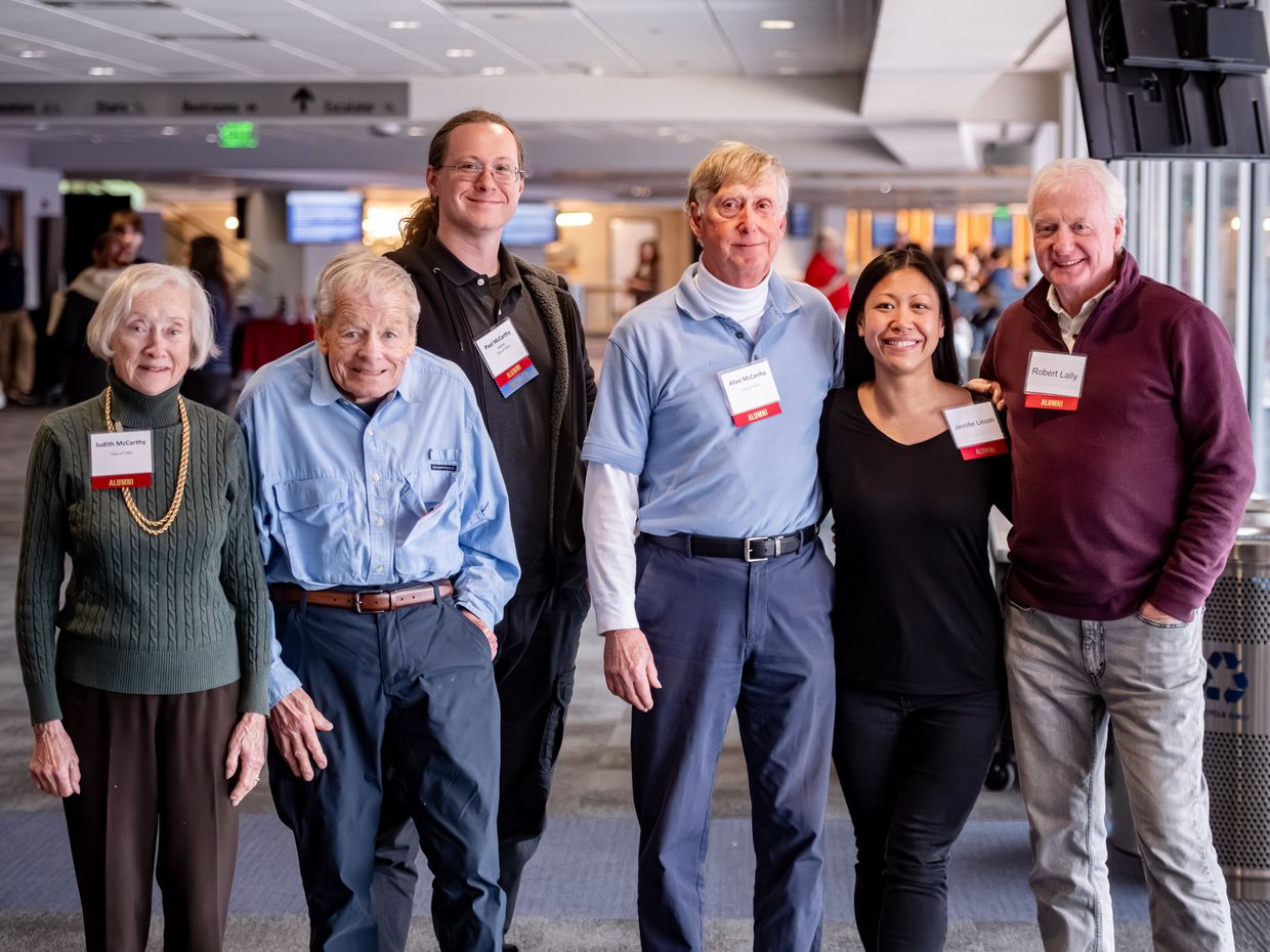 A group of alumni at the MCPHS Reed Conference smiling. 