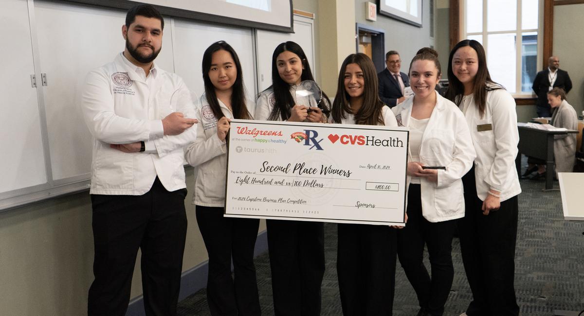  This year’s School of Pharmacy Capstone Competition took place on April 10, with 28 teams participating. Taking second place honors was “GlobalUnity,” a nonprofit vaccination service for refugees and migrants, offering culturally sensitive healthcare in collaboration with local public health departments, providing counseling, screenings, and immunizations. The team was led by Veronia Ibrahim, project manager, with Kiara Rubino as assistant manager, and members Vanessa Araujo, Ammar Janoudi, Siyeon Park, and Maianh Tran.