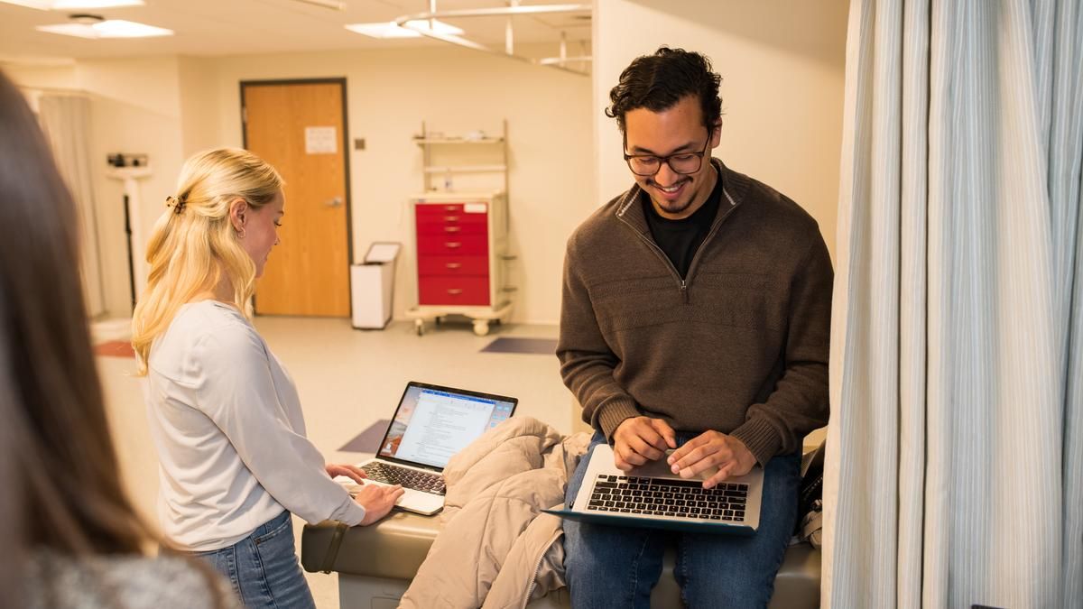 Students collaborating in lab space