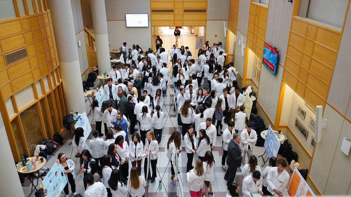People standing at the MCPHS Boston Capstone Business Plan Competition.