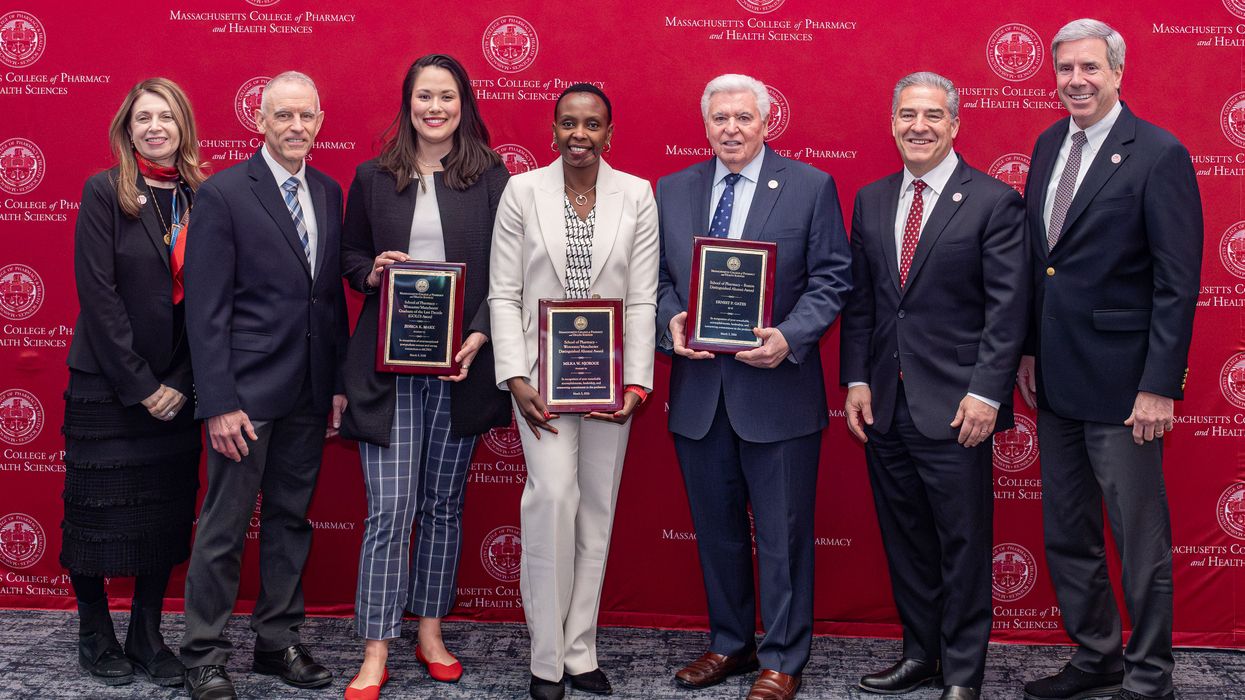 A group of people holding awards at the MCPHS 2026 Reed Conference.