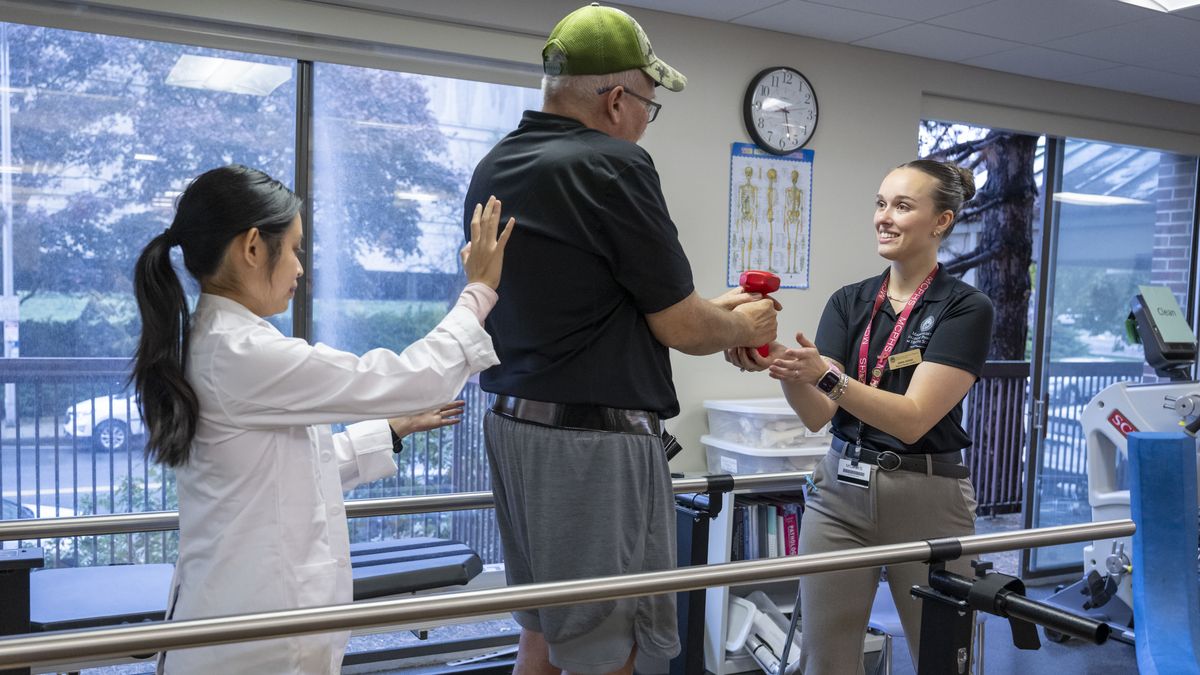 Physical Therapy student working with a patient.